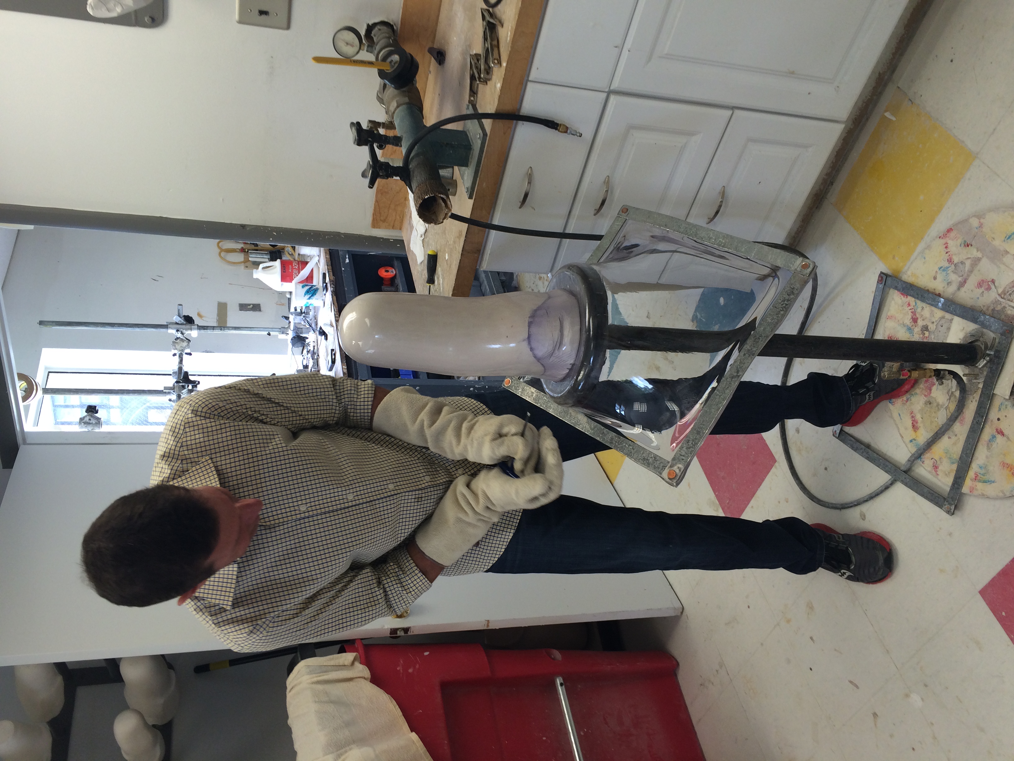 Once the cast is made, they place a piece of plastic over it and melt it down to make the socket.