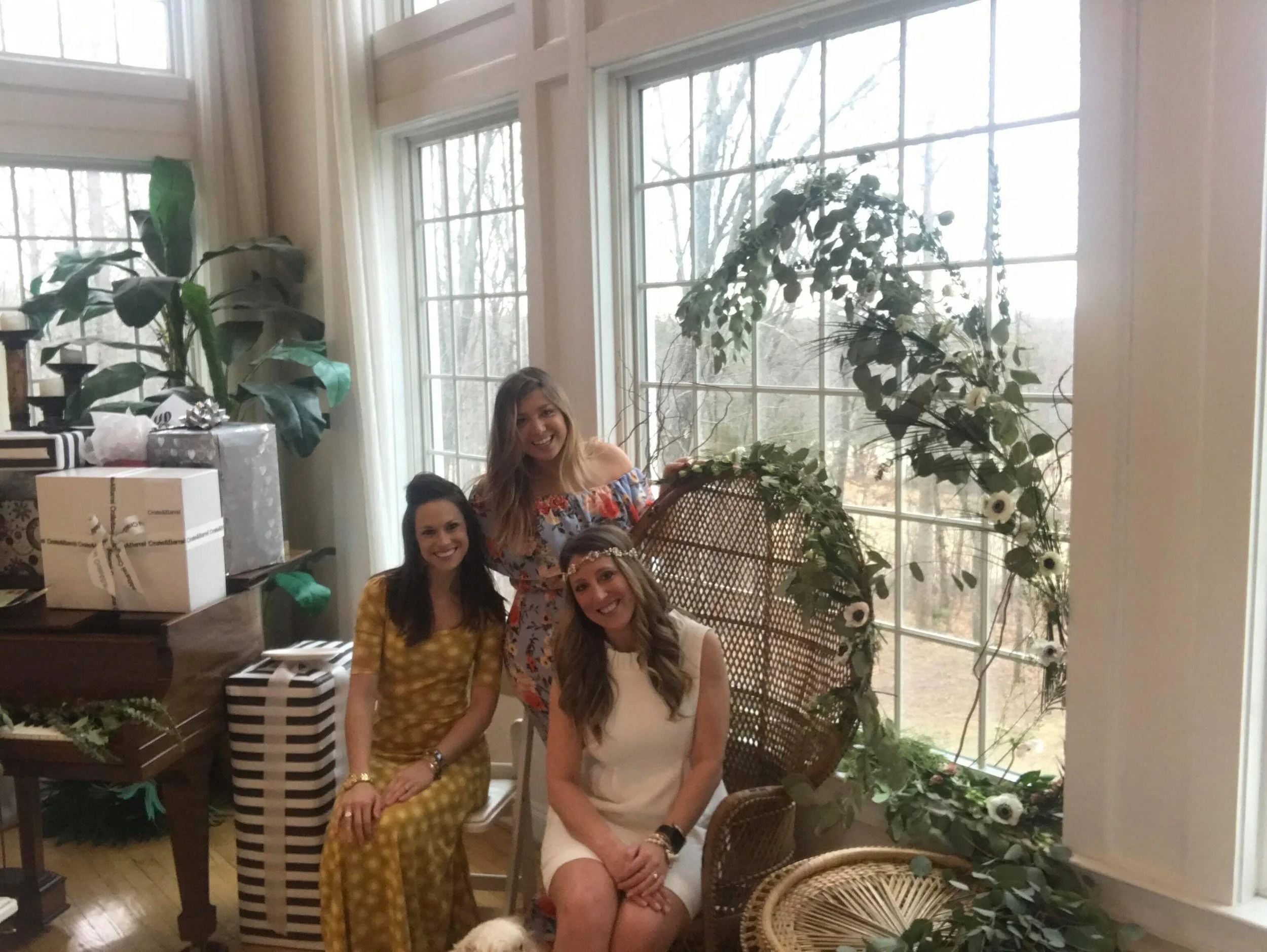one of my bridesmaids, whitney, jeri/maide of honor, and me! check out that chair and greenery- isn'y it to die for?!