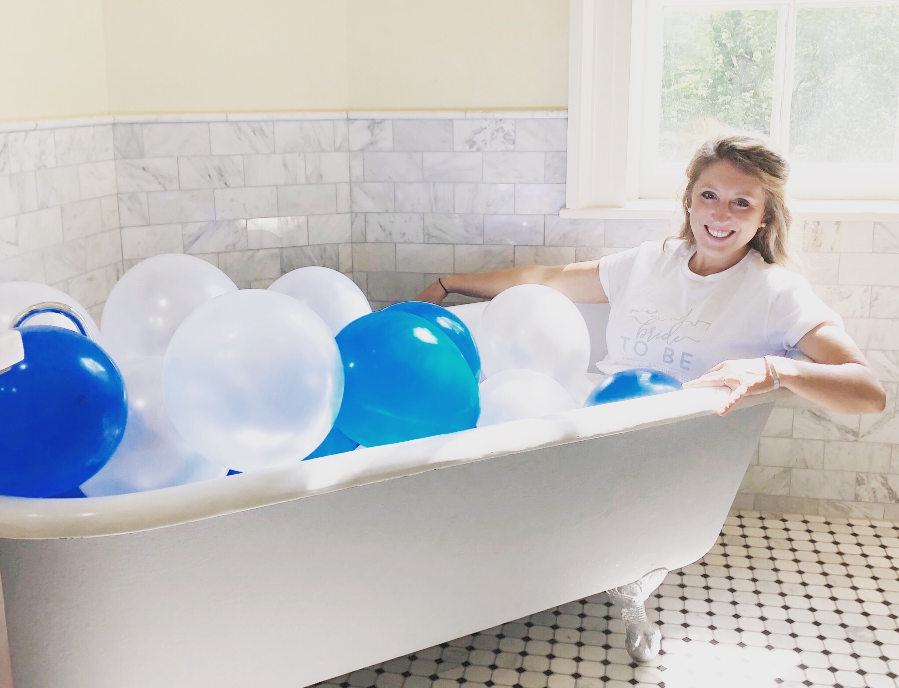 Because who doesn't hang out in a beautiful porcelain tub with balloons?!