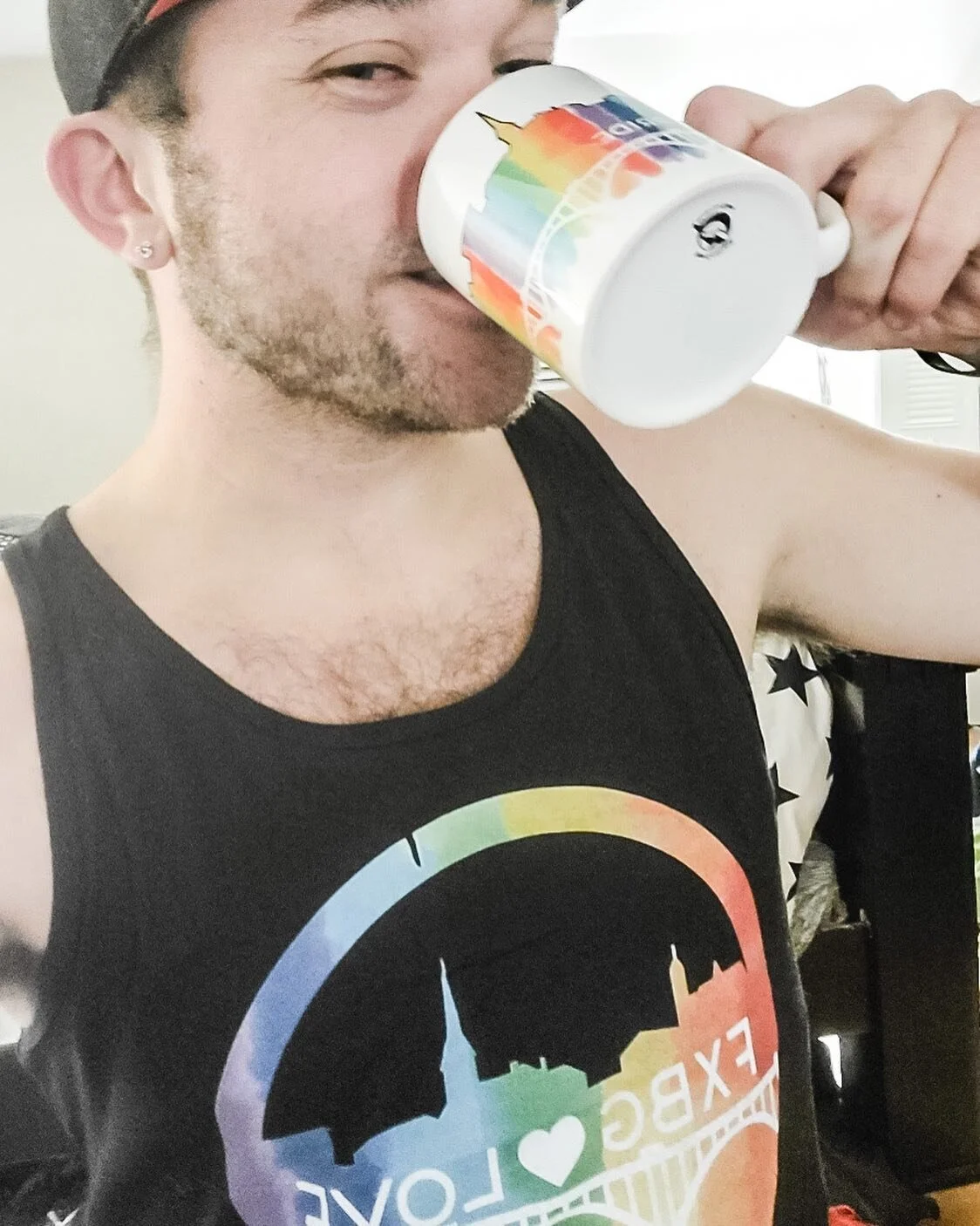 Love my model, @mayers87 in the Fredericksburg pride tank and holding the pride mug! Snag yours today to get it in time for the @FXBGPride March on June 25. Tanks and T-shirts available. You can purchase through my website (link in profile) or Instag