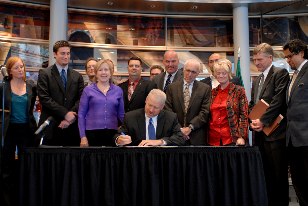 The Mayor of Seattle signs an ordinance creating a regulatory framework for marijuana in the city. Photo: Jen Nance.