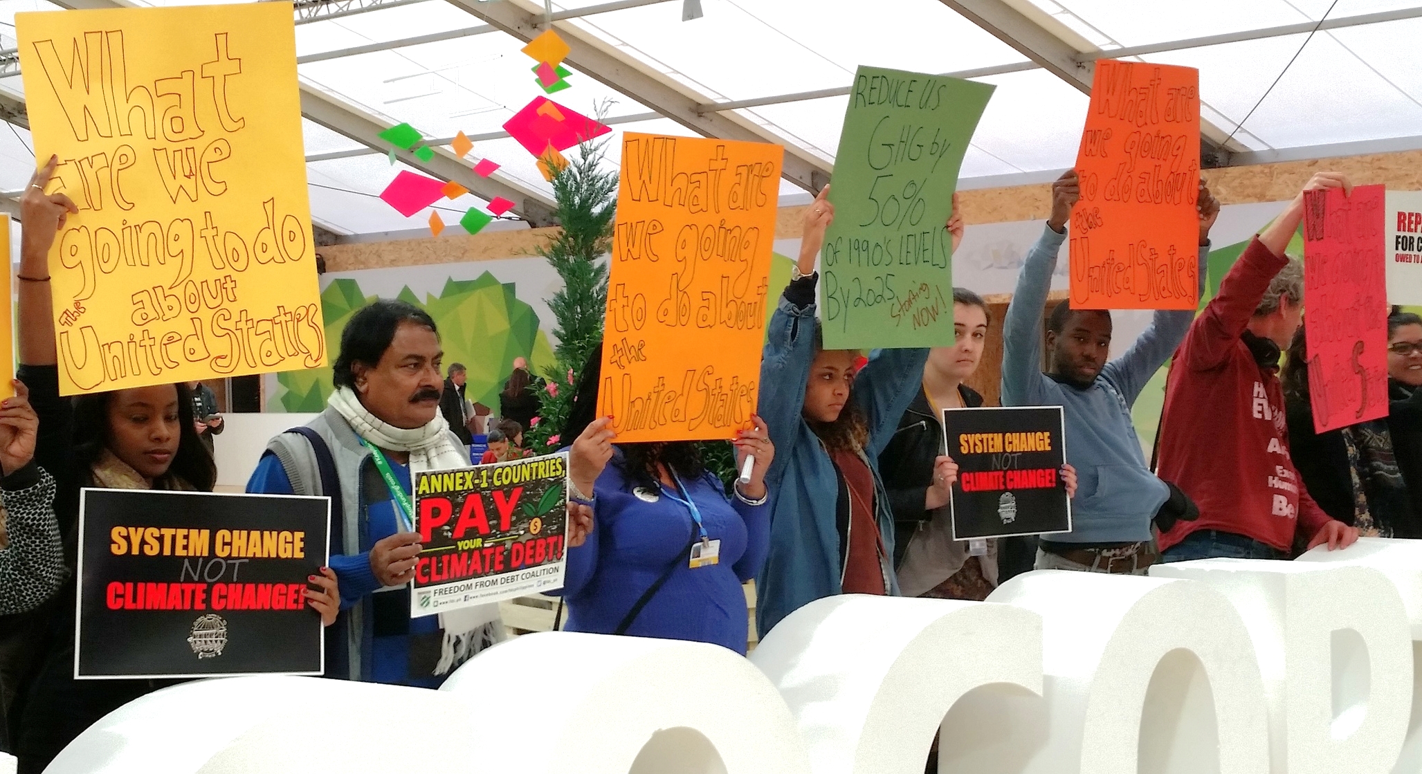 Protesters at COP 21 target developed countries in demanding reform. Photo: Ryan Stoa.