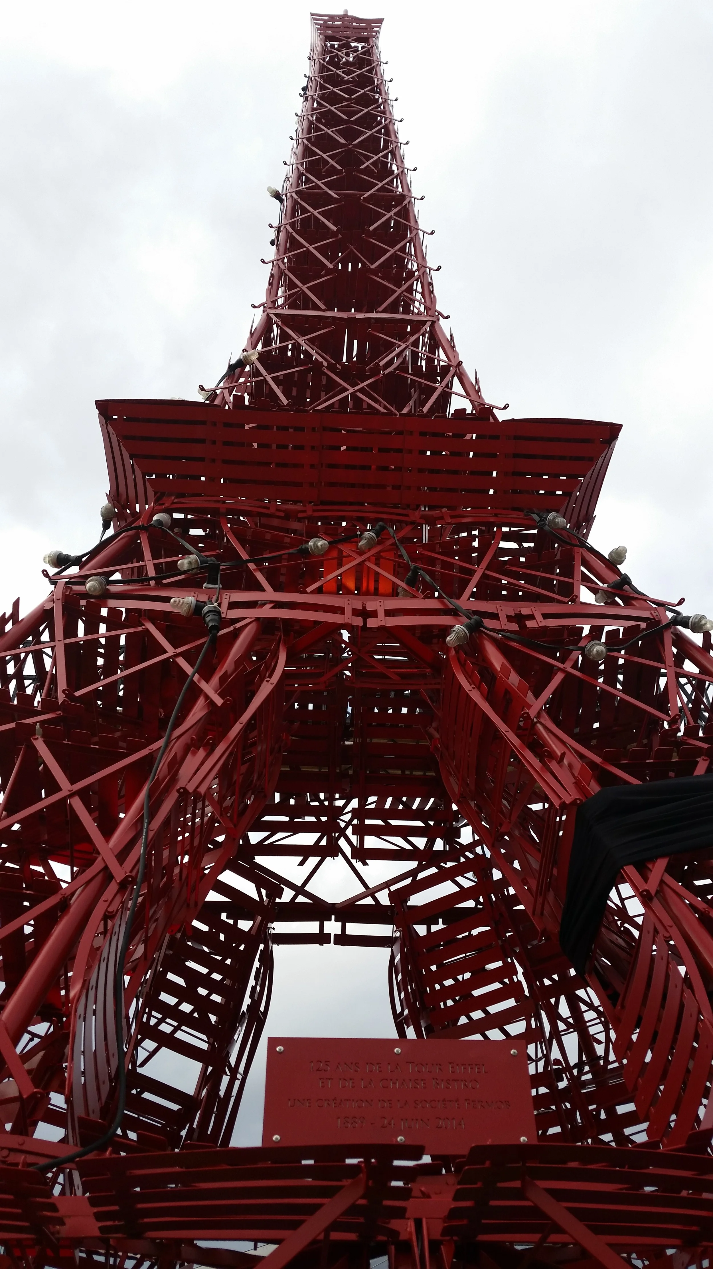 A replica of the Eiffel Tower made from bistro chairs stands at the COP 21 conference venue. Photo: Ryan Stoa.