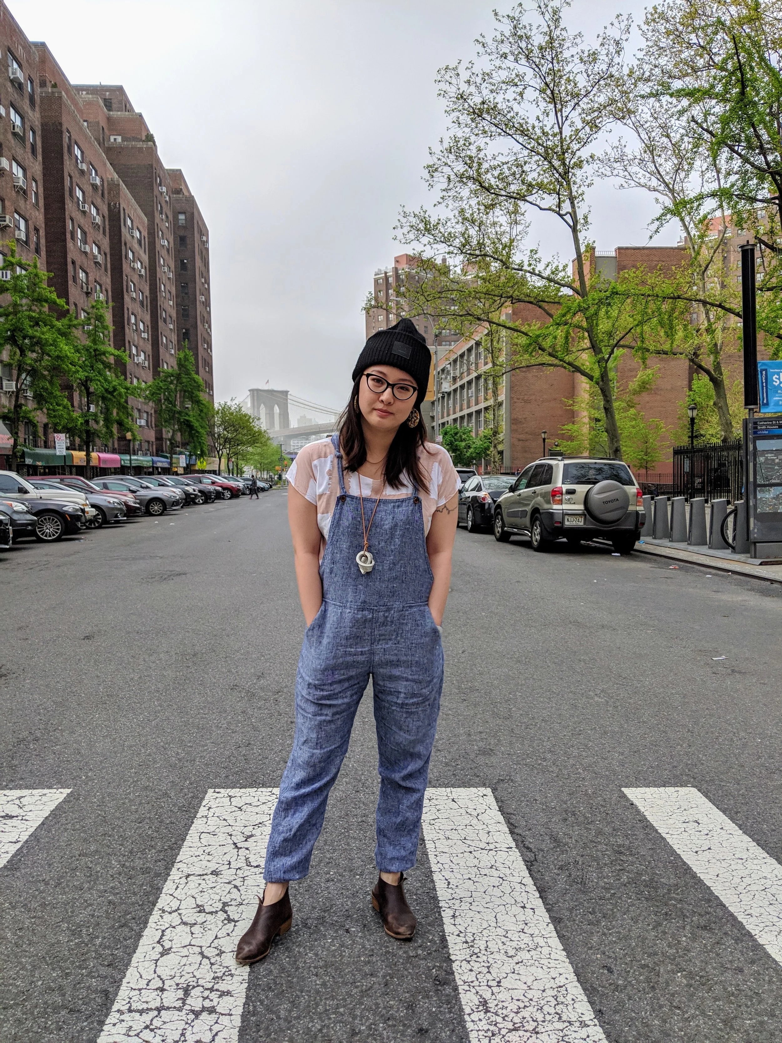 Salina wears the Overalls in Blue Chambray