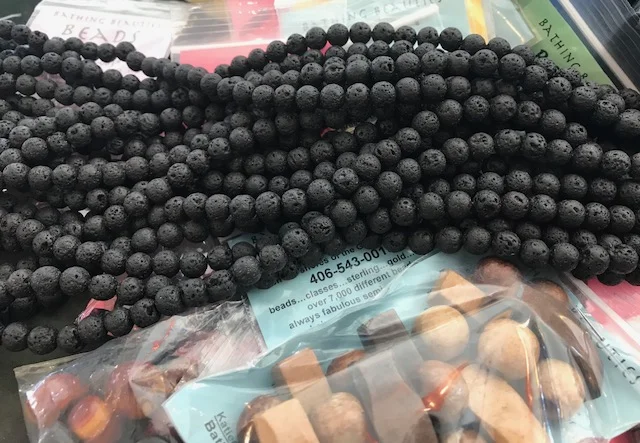 Each packet will have one strand of lava stones and one "wild card" bag of beads
