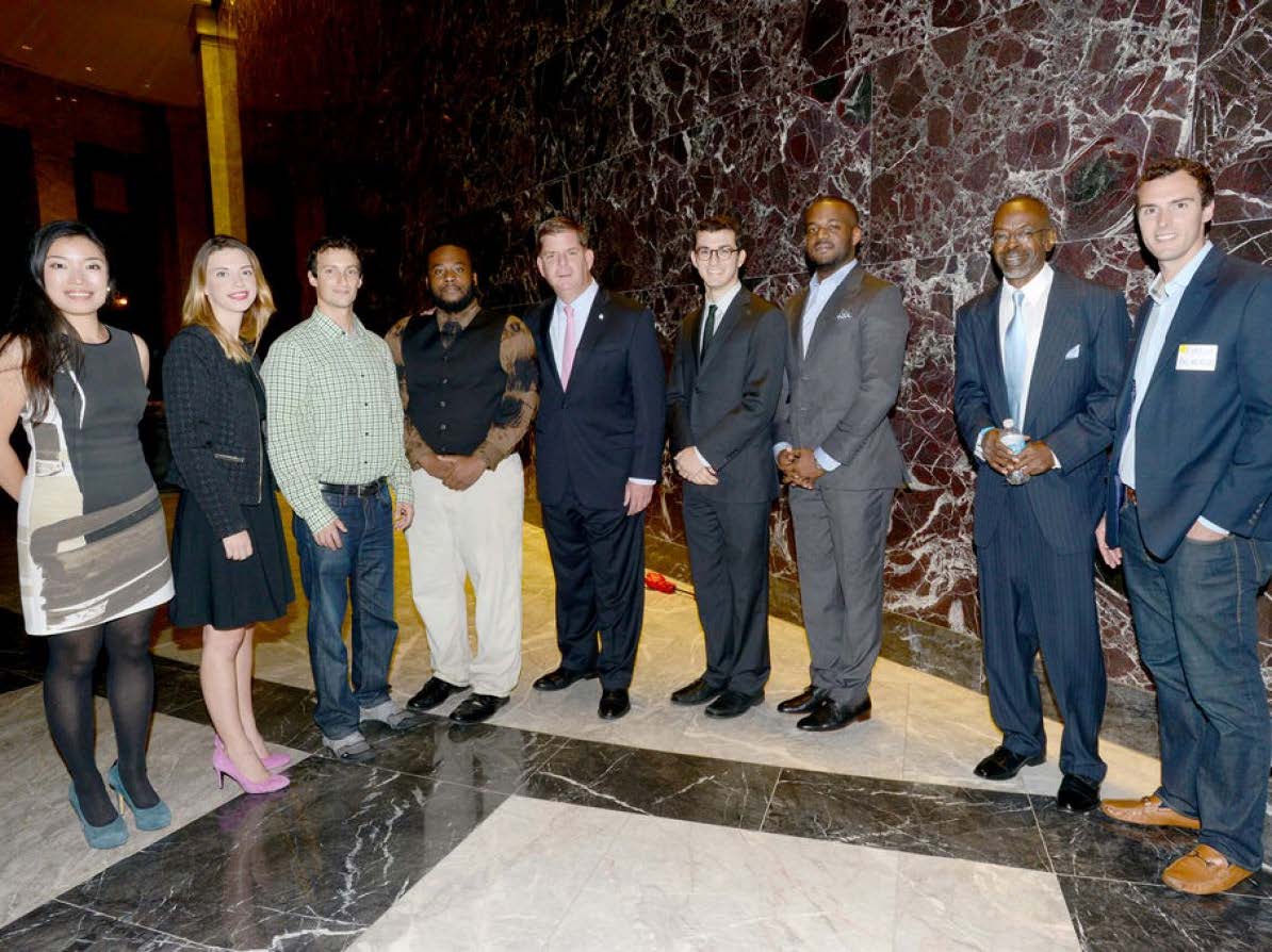 Aeron (left) with Boston Mayor Marty Walsh and other OneIn3 award winners. (Photo by the Mayor’s Office/Don Harney)