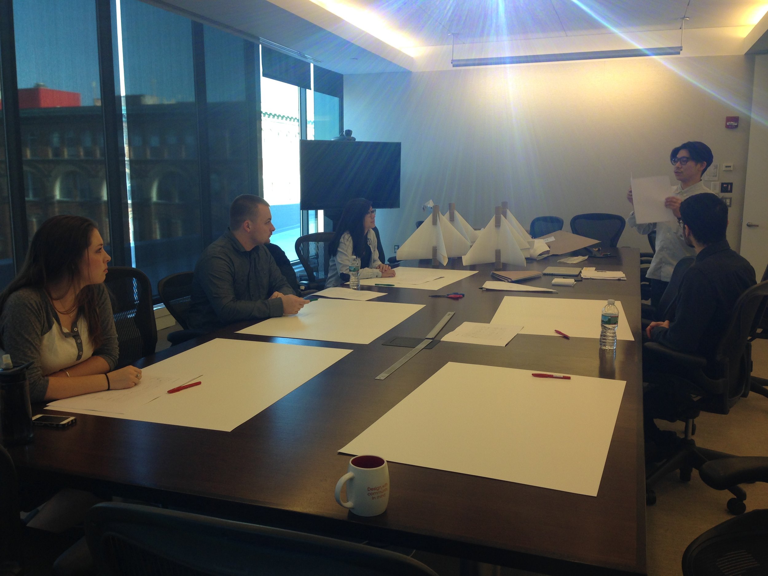 Kohji Kawabata, on the top right hand corner, folding and creating paper pieces with our team