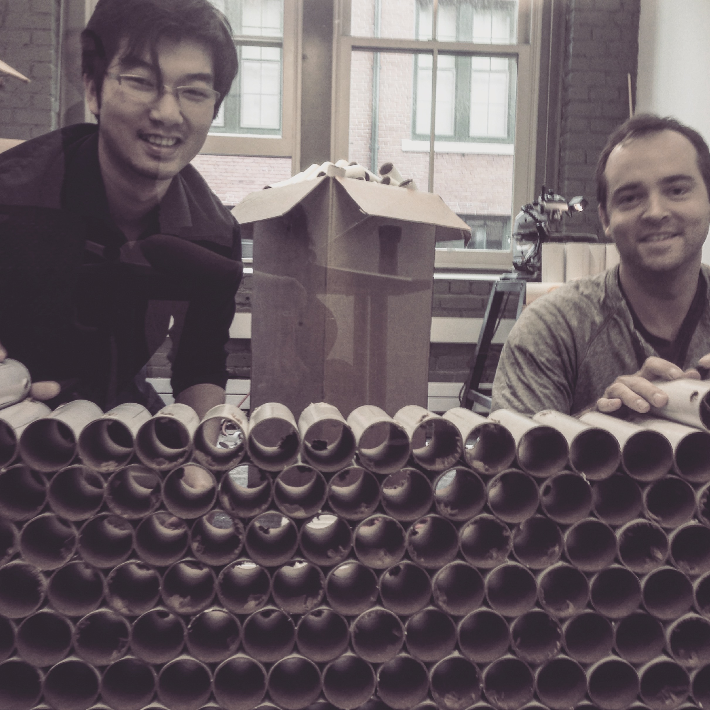 Card Board Tubes Everywhere! Our dear Erick and James having a fun afternoon with band saws and card board tubes