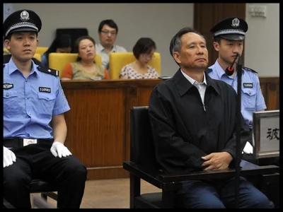 ZHANG SHUGUANG SITS DURING HIS 2013 TRIAL FOR CORRUPTION. ZHANG, THE FORMER DEPUTY CHIEF ENGINEER OF CHINA’S MINISTRY OF RAILWAYS AND RIGHT-HAND MAN OF MINISTRY HEAD LIU ZHIJUN, ADMITTED TAKING BRIBES, BRIBES THE PROSECUTION PUT AT 47.55 MILLION YUAN ($7.7 MILLION). ZHANG BOUGHT A CALIFORNIA MANSION IN 2002 DESPITE BEING ON A MONTHLY SALARY OF 2,200 YUAN ($265 AT THE EXCHANGE RATE FOR THE TIME).