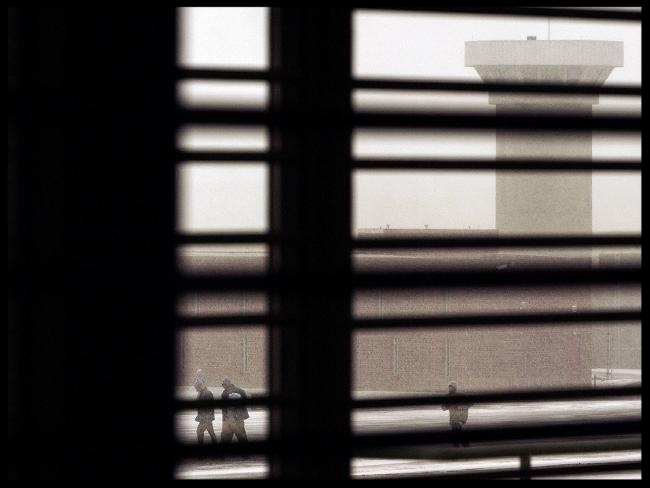 Inmates make their way across the snowy yard at the ADX supermax . Source: AP