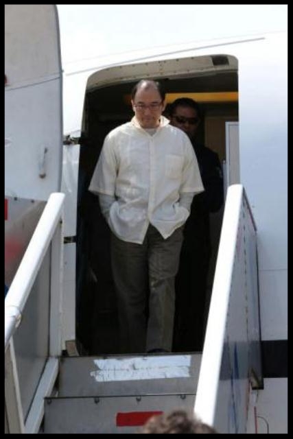 Zhenli Ye Gon, a businessman accused of working with drug cartels, is escorted by Interpol agents after arriving from the United States on a extradition flight in a hangar belonging to the office of the Attorney General in Mexico City, Mexico, October 18, 2016.