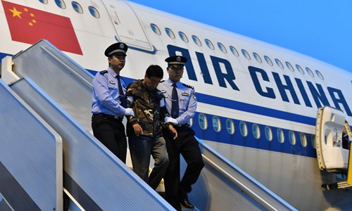 Liu Changkai, one of China's most wanted fugitives, returns to the Chinese mainland to turn himself in to police. Photo: VCG