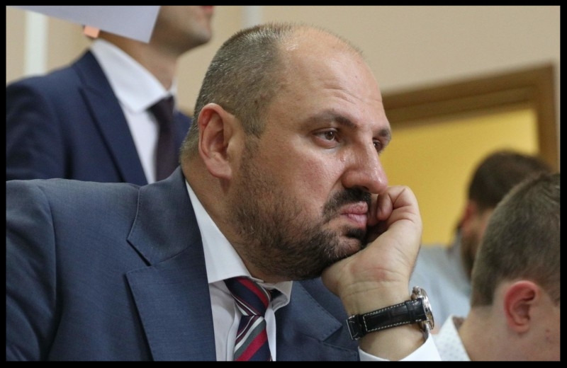 A lawmaker from President Petro Poroshenko's Bloc Borys Rozenblat listens his lawyer in Kyiv's Solomyansky Court on July 18.