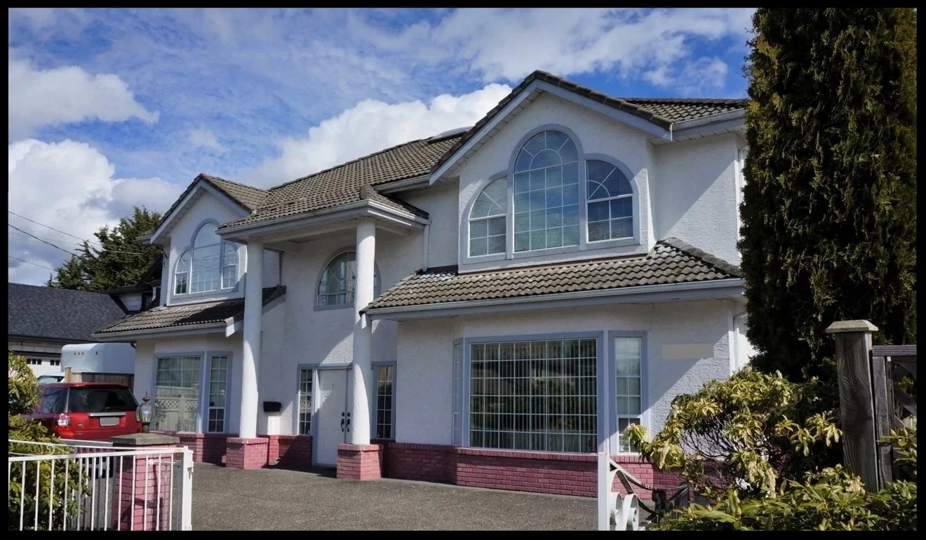 The home of the former unlicensed immigration consultant Xun ‘Sunny’ Wang, in Richmond, British Columbia. Since being freed from prison, Wang has returned to the $1.5 million home that was among locations raided by Canadian border officers on October 17, 2012.