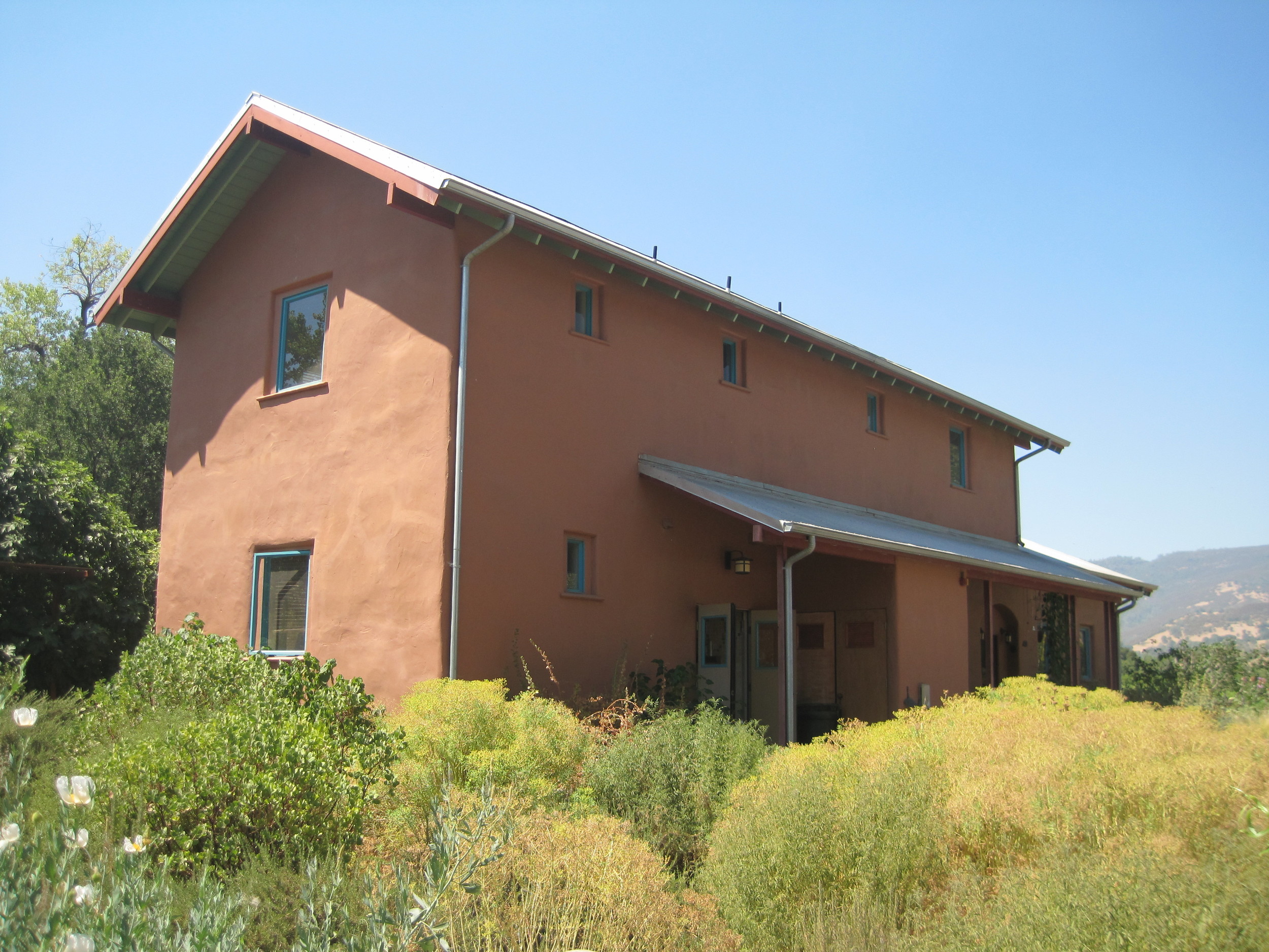   A deep porch helps to shade the southern facade  