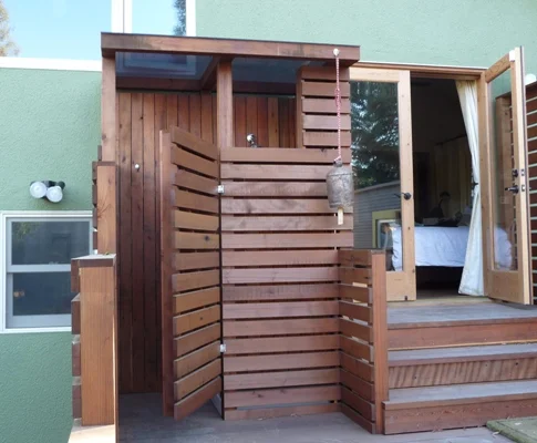 In addition to adding a half bath inside, an outdoor shower was also added on the new rear porch.