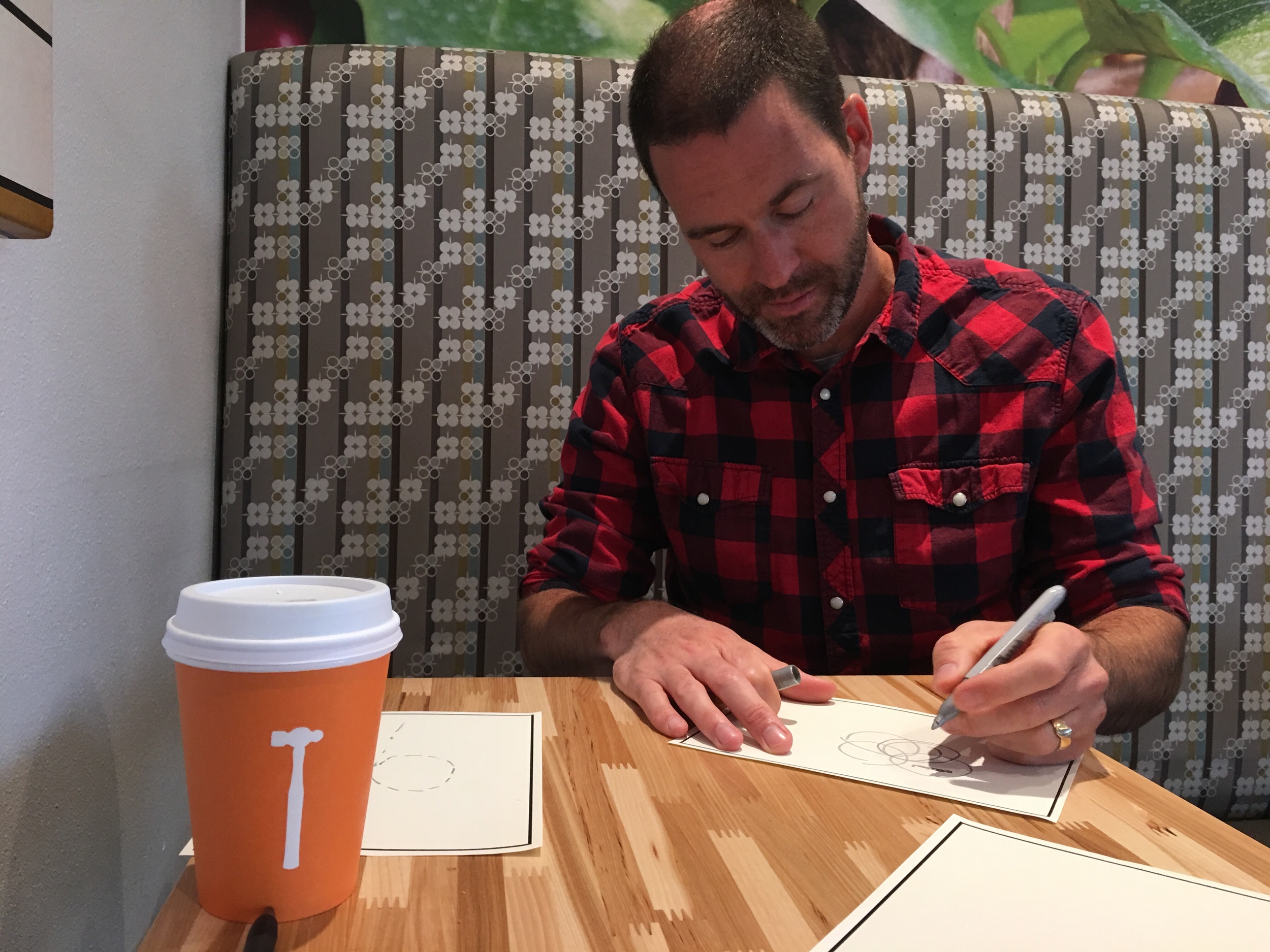 Miller drawing out a diagram at Thomas Hammer coffee in Northern Spokane. Not photoed- Pear Soda