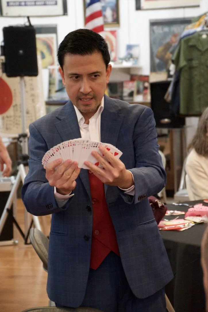 Professional magician Christopher Moro performing expert sleight of hand card magic.