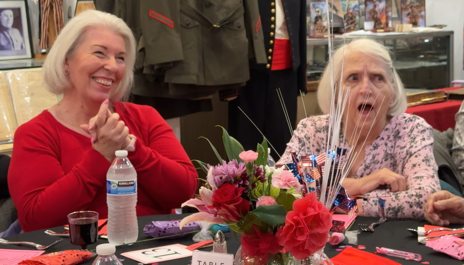 Guests laughing and enjoying a professional magic performance at a private event.