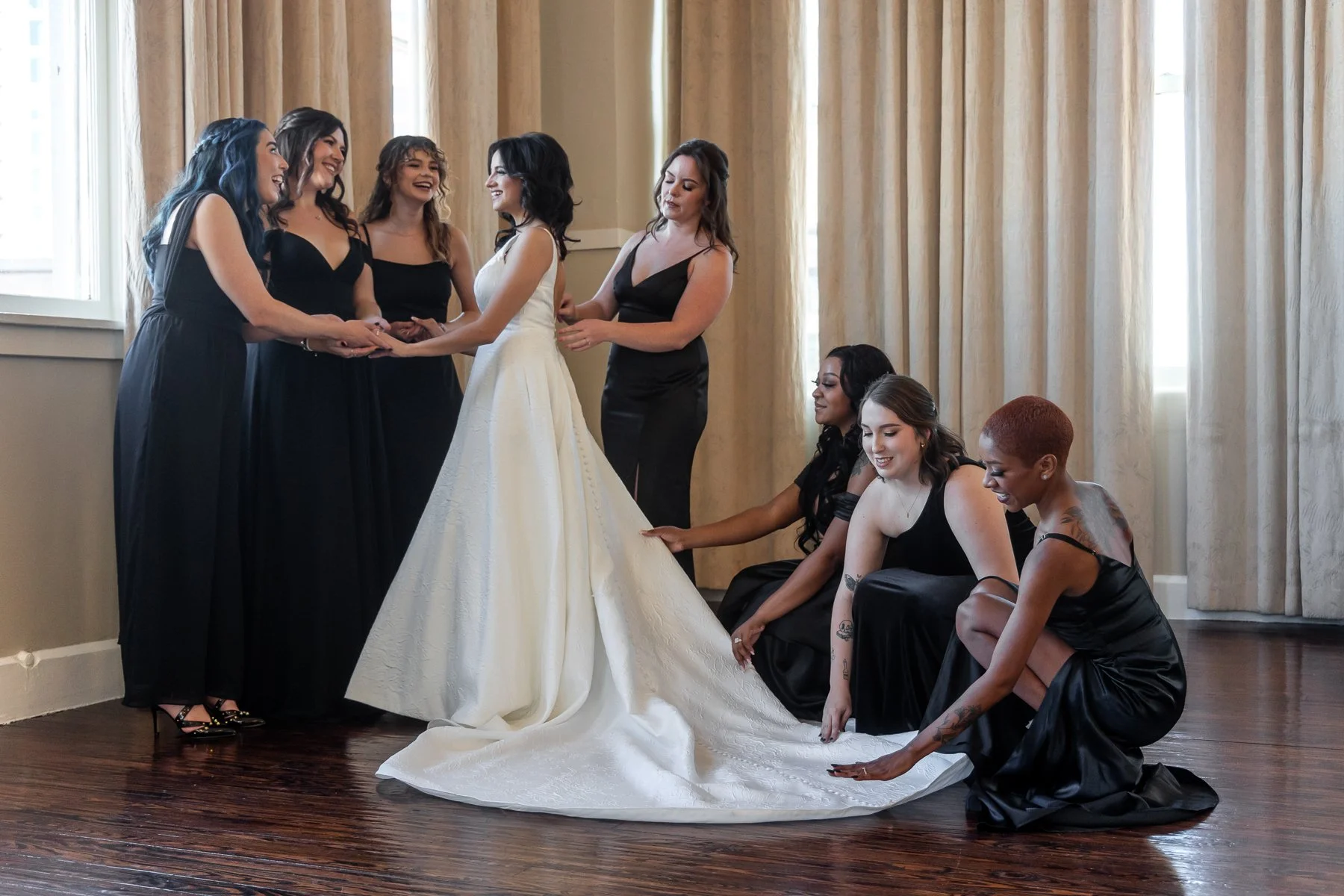 Bride getting ready with her bridesmaids before a wedding at The Room on Main in Dallas
