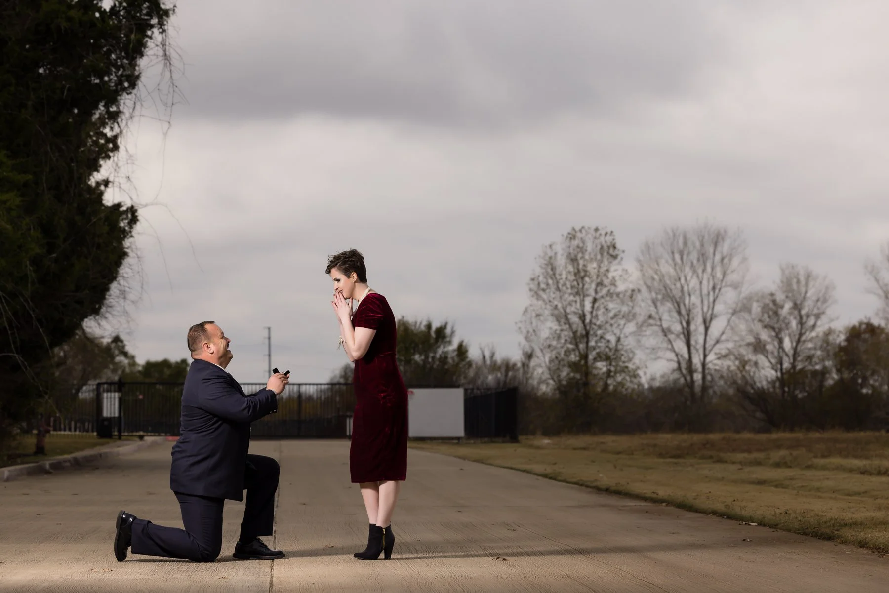 Firefighter surprise proposal photographed in Dallas–Fort Worth with the groom down on one knee