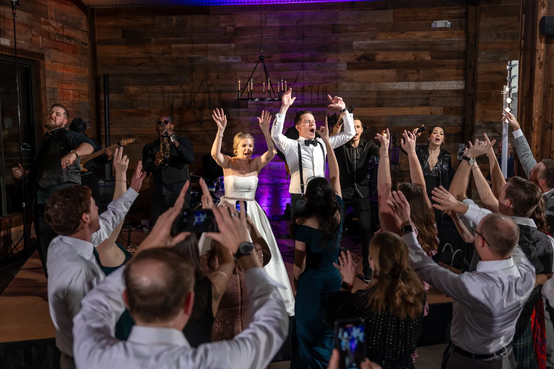 Wedding guests celebrating with the newlyweds during the reception at Stone Crest Venue near McKinney, TX.