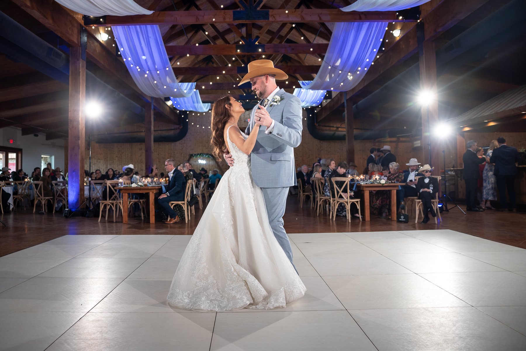 Bride and groom dancing during their Lucky Spur Ranch wedding reception in Justin, TX.