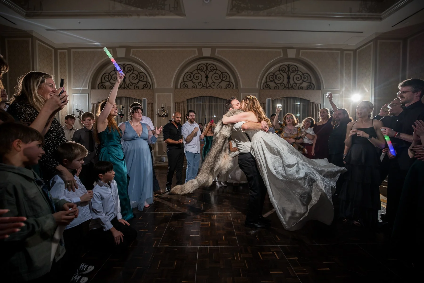 Bride celebrating with family and friends on the dance floor at The Adolphus Hotel