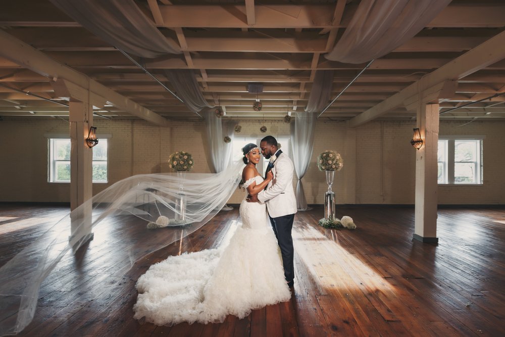 Bride and groom sharing a romantic portrait inside The Brik in Fort Worth, Texas.