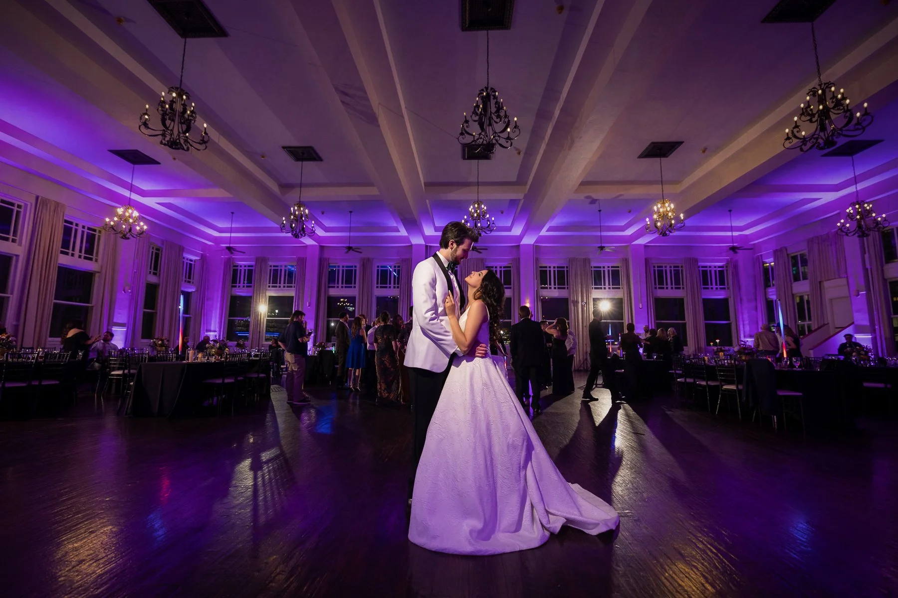Bride and groom sharing their first dance during a wedding reception at The Room on Main in Dallas