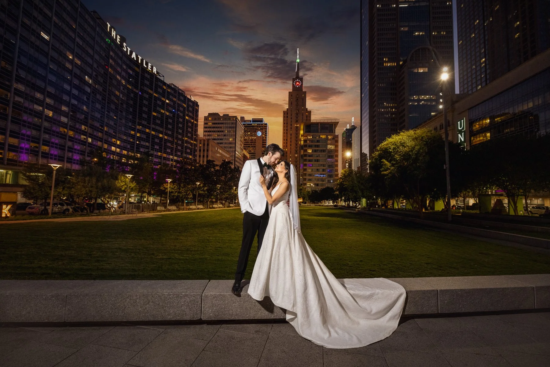 Bride and groom photographed at sunset in downtown Dallas during their wedding at The Room on Main