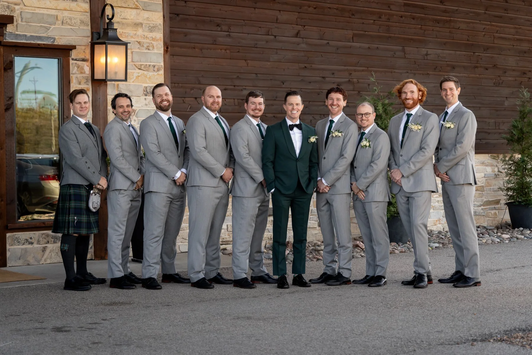 Groom and groomsmen photographed outside Stone Crest Venue near McKinney, TX.