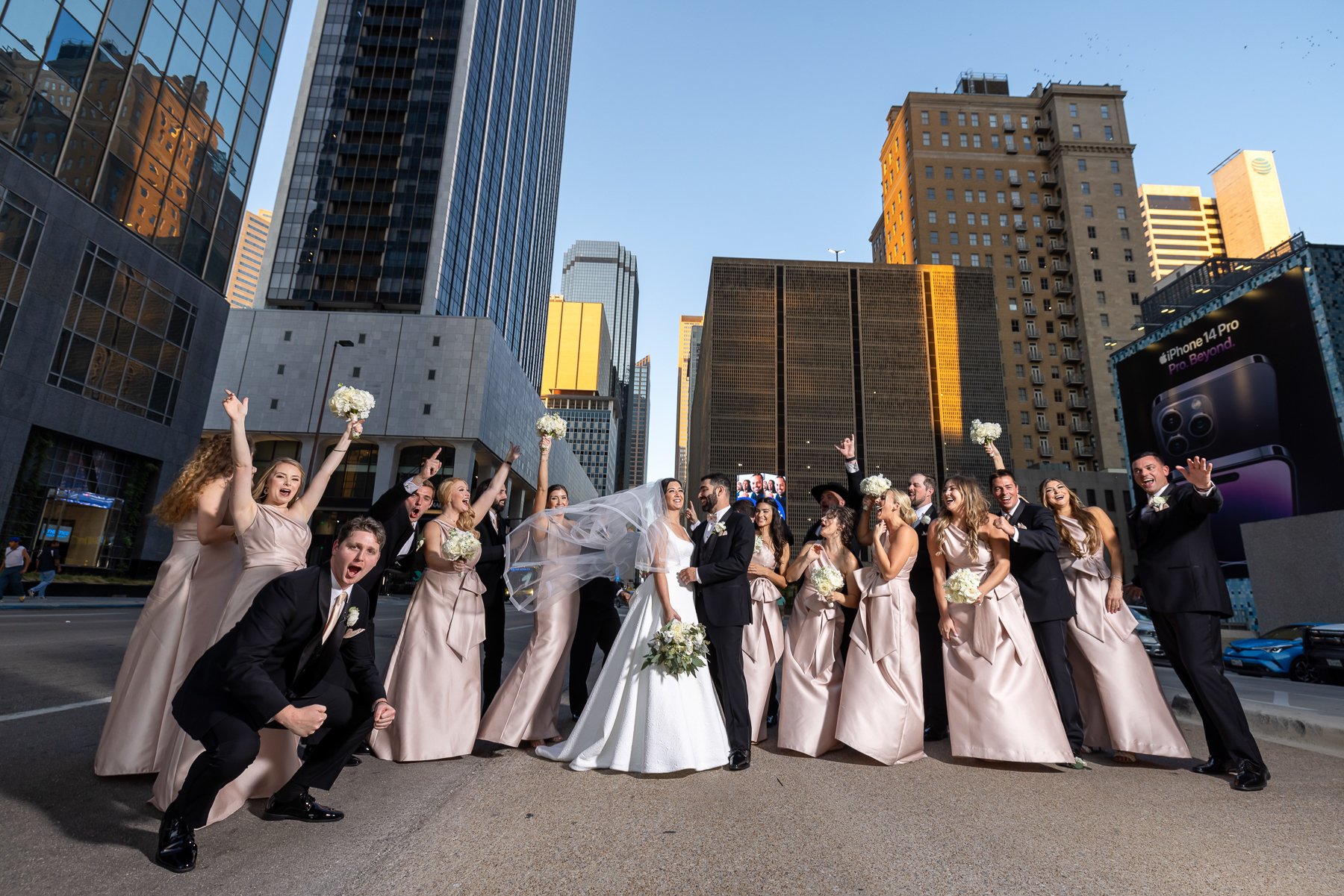 Bride and bridal party portrait during a wedding at The Westin Dallas Downtown