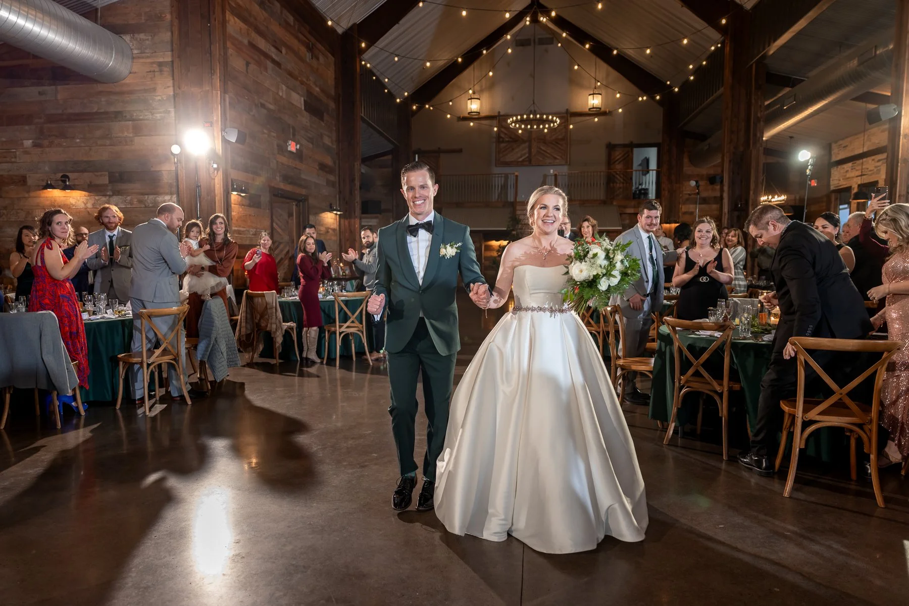 Bride and wedding guests dancing together during the reception at Stone Crest Venue near McKinney, TX.