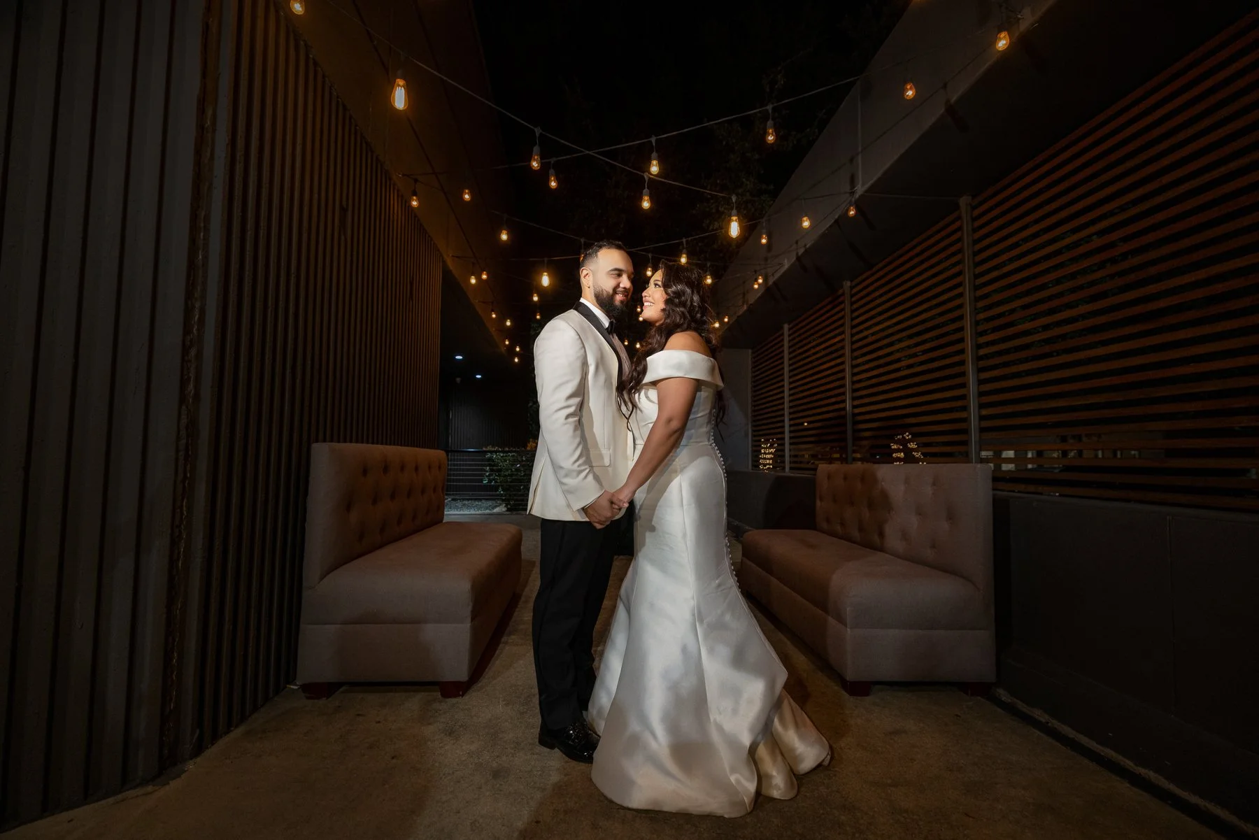 Bride and groom during a nighttime wedding portrait near The Hall on Dragon in Dallas