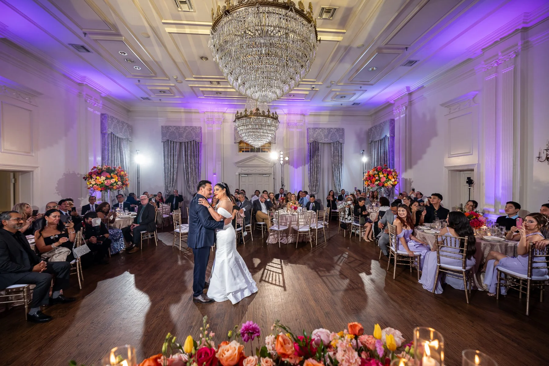 Bride and groom sharing their first dance during an Arlington Hall wedding reception in Dallas.