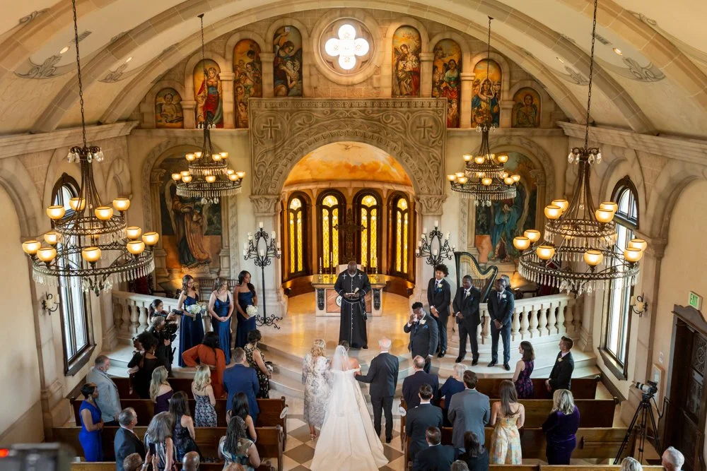 Wide elevated view of Mallory and Marcus’s ceremony inside Bella Donna Chapel.