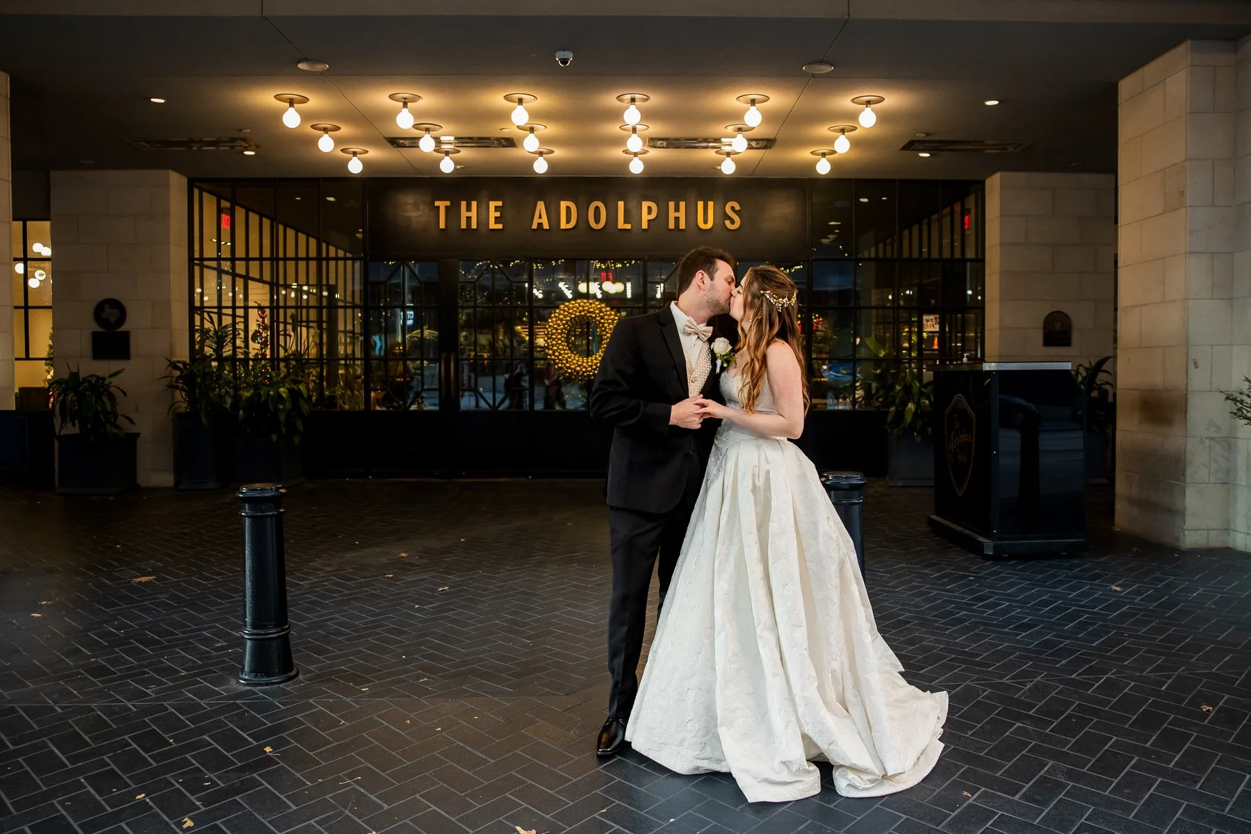 Bride and groom outside The Adolphus Hotel during their downtown Dallas wedding