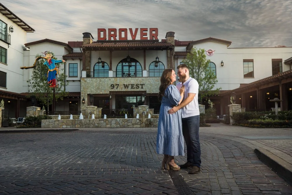 Lacey and Trey together outside Hotel Drover with the building and sign behind them.