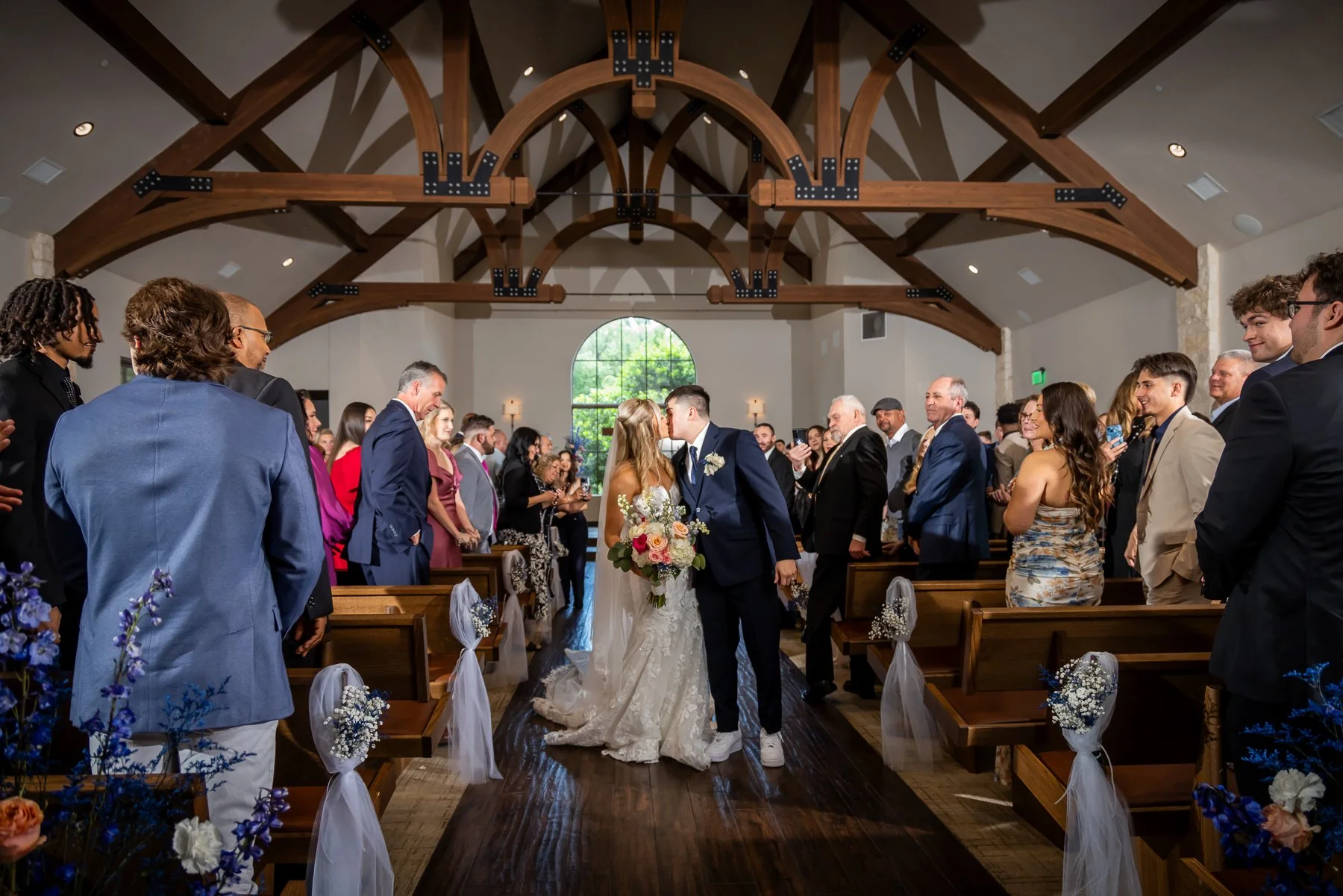 Bride and groom during their wedding ceremony at The Laurel chapel in Grapevine, Texas.