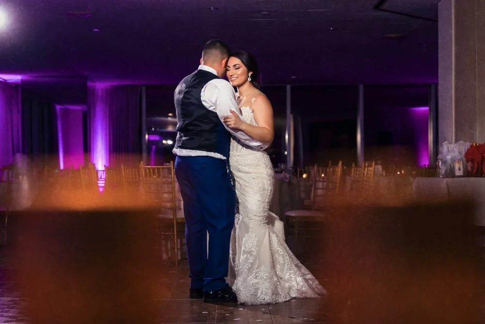 Bride and groom sharing an intimate first dance at their wedding reception.
