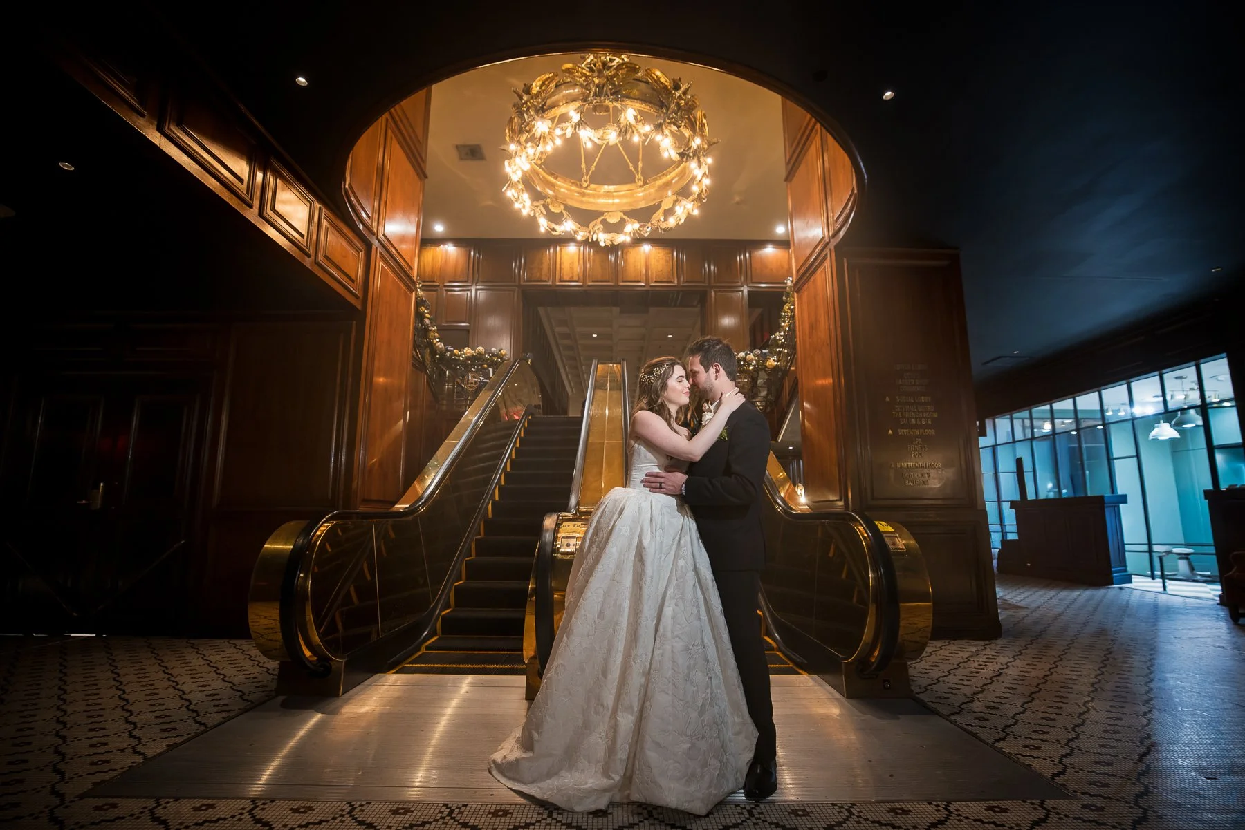 Bride and groom portrait on the grand staircase inside The Adolphus Hotel in Dallas