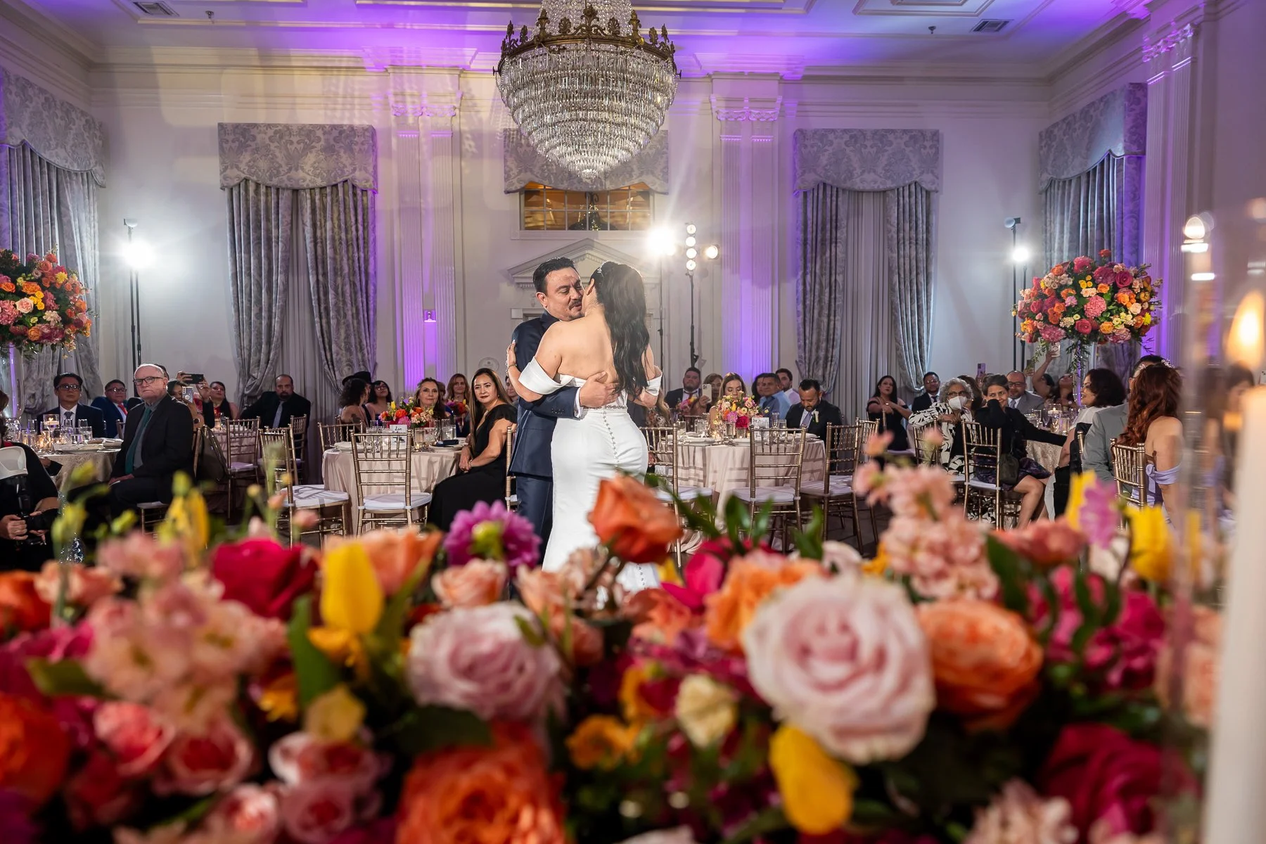 Bride and groom sharing an intimate moment during their first dance at Arlington Hall at Turtle Creek.