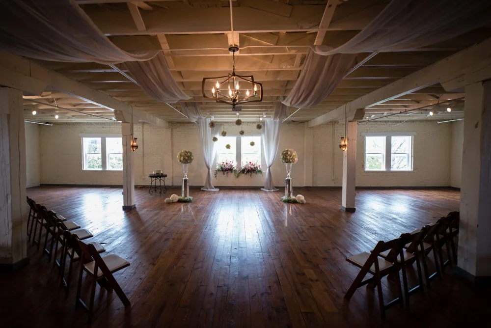 Wedding ceremony space set up inside The Brik in Fort Worth, Texas.