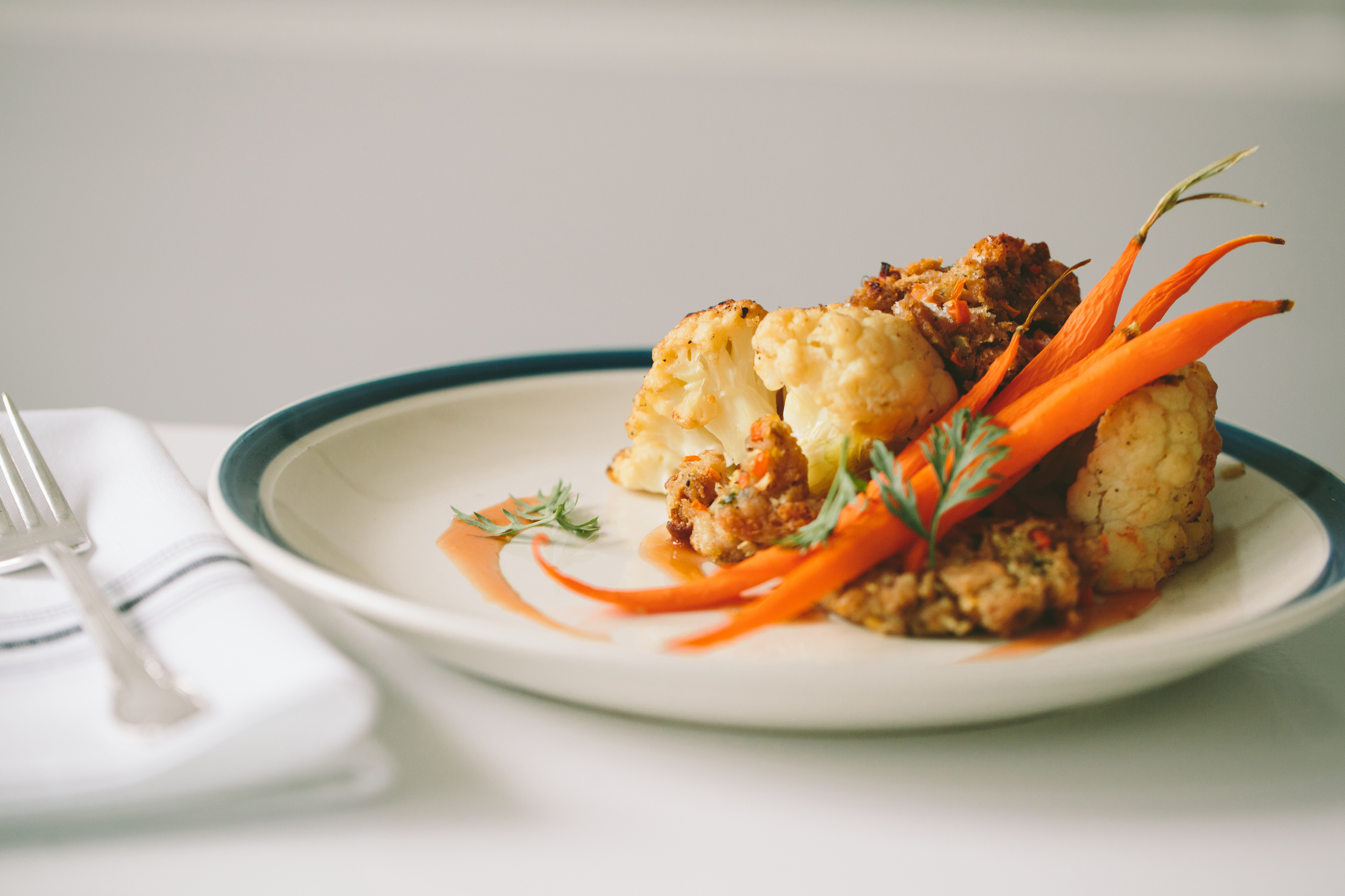 cauliflower roti. bread stuffing, carrots, vegetable demi-glace