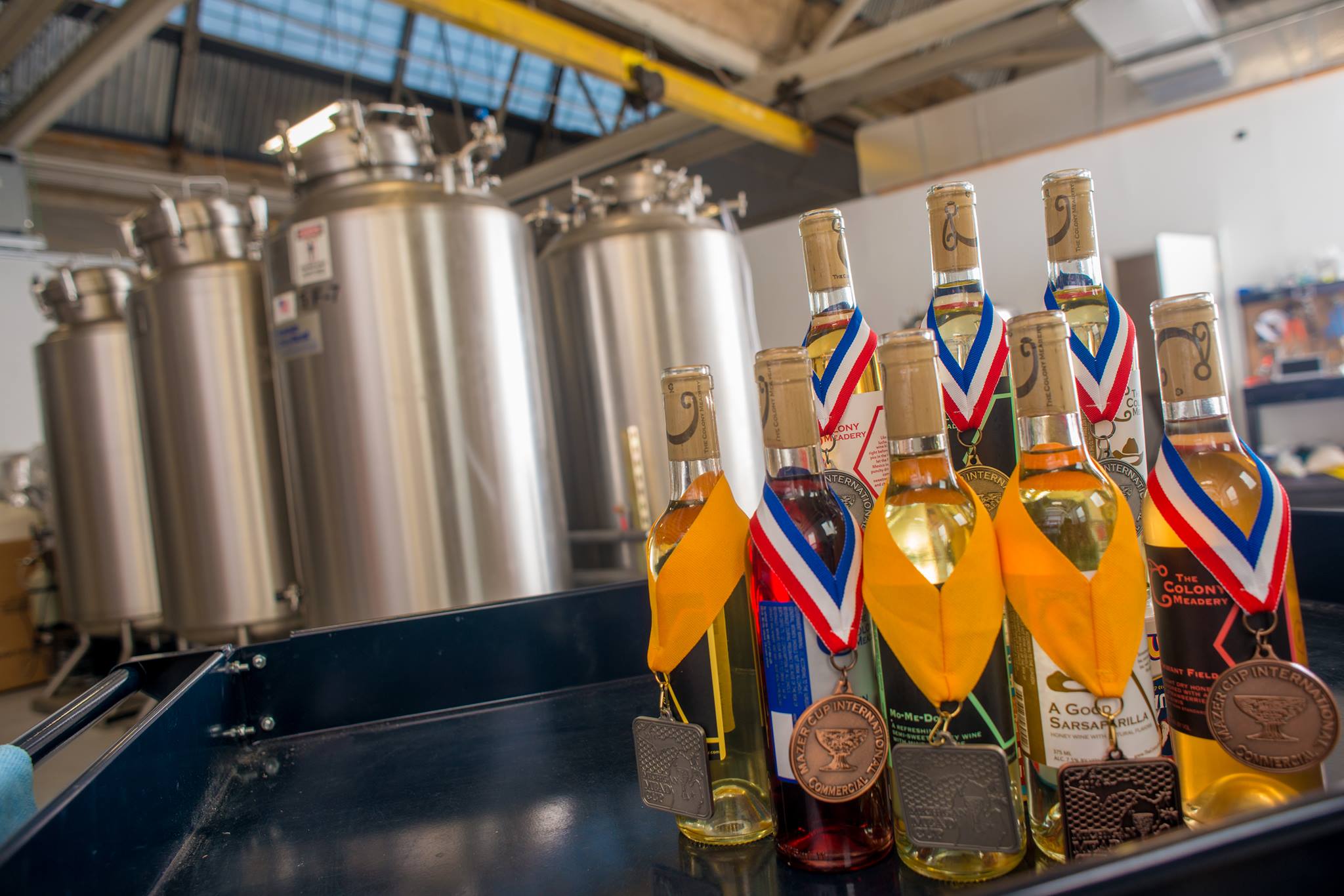 Colony Meadery meads with a few of the more than 15 medals they have won in competition.