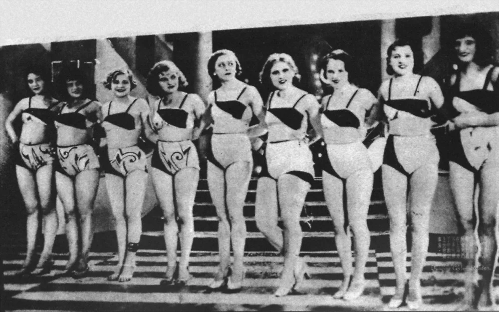A chorus line, probably of Russian women.