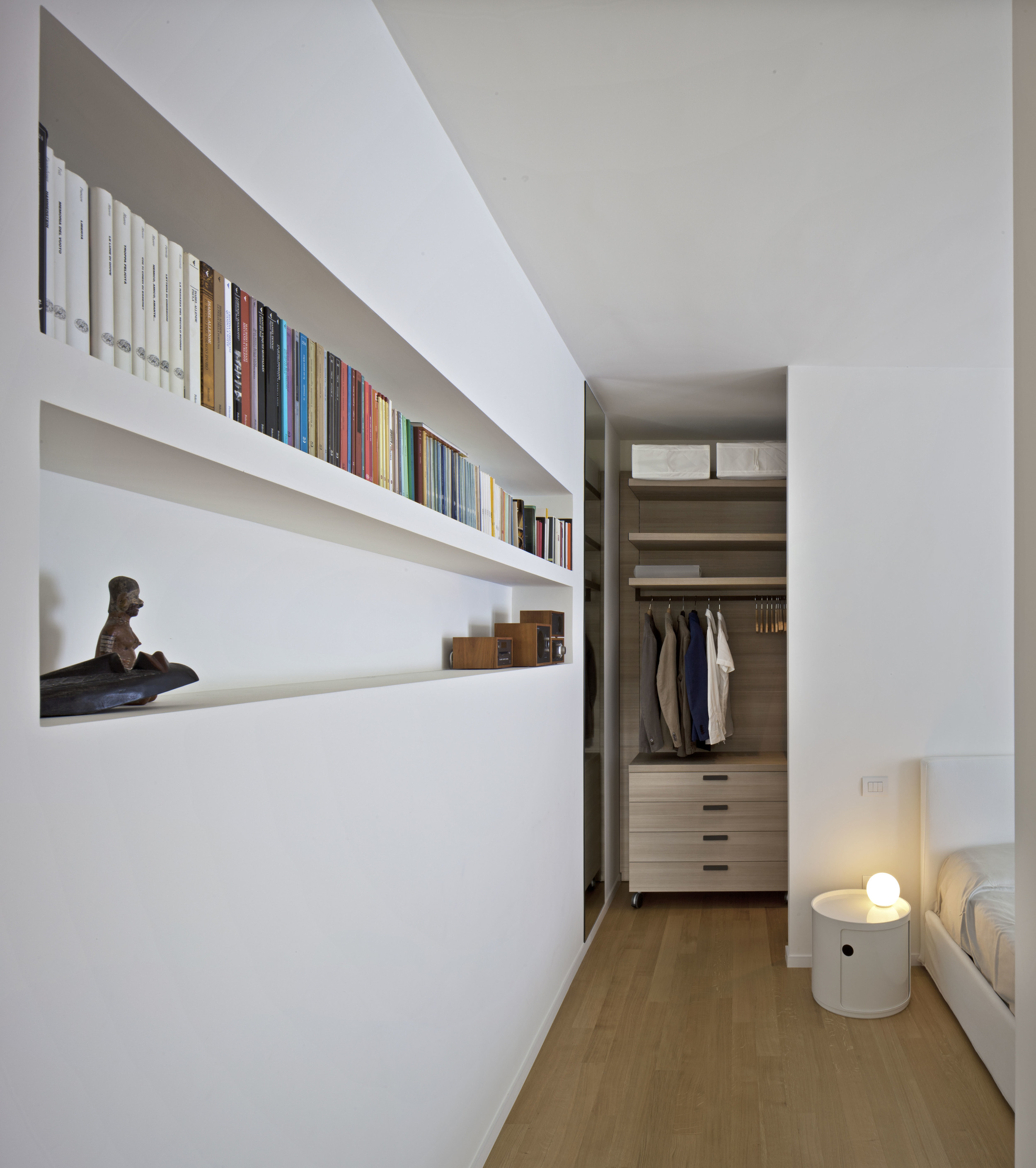 NI House, Matera The project involves the interior spatial rearrangement of an apartment in the centre of Matera. The work retains the pre-existing bearing structure constituted by beams and pillars. The new, fluid and versatile spaces have been cr