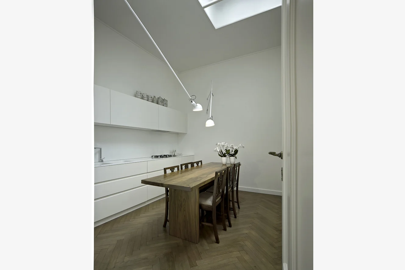 ER House, Venice Overlooking one of the Grand Canal’s most picturesque corners, this apartment is the outcome of the division of a larger house, of which it constituted the service area. The project respected the character of the apartment, valuing the existing historical structure through a philological restauration, and yet marking with contemporary features the originally unattractive spaces. The spaces have thus gained a new identity thanks to a few interventions to the masonry structures which aimed at redefining the proportions and adjusting them to a new intended use. These careful choices and the revision and relocation of the connecting passages between rooms give the house its final shape. Date: 2012 | 2013 Architect: Paolo De Benedictis Assistants: Emina Gauzanovic, Francesco Virgilito Services Engineer: Studio Multimpianti Structural Engineer: Massimo Moretto Photography: Alessandra Chemollo << change project >> 