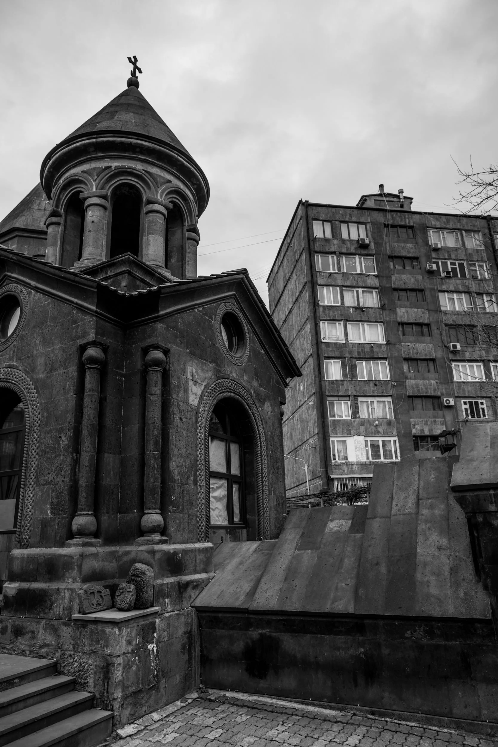 Zoravor S. Astvatsatsin Church sits hidden amongst its significantly younger and ugly concrete 'friends'